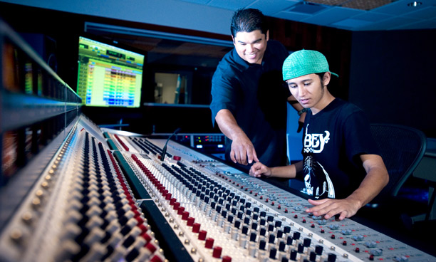 John Vierra and Mele Audio Engineering student Taylor Rohrbacker at the Rupert Neve analogue console at Honolulu Community College