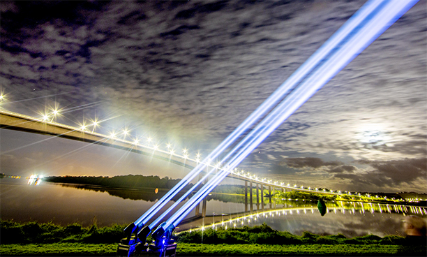 Spotlights over the Foyle Bridge, Derry, as part of the Global Industry Awareness Day for the Production Services and Live Events sector