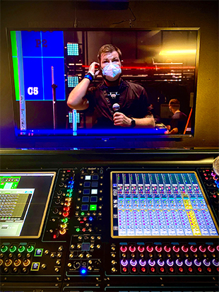 Monitor engineer Matt Russell on the iHeartRadio Theater stage, seen on the display over the DiGiCo Quantum338 monitor console