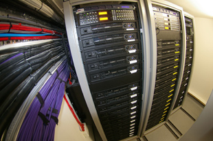 QSC amp racks in the technical room