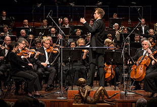 Vasily Petrenko conducting the orchestra