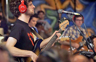 Bassist and band leader Michael League with AE4100 handheld mic and ATH-M50RD headphones Snarky Puppy