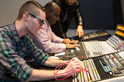 Students at Tri-C work on the API 1608-II console