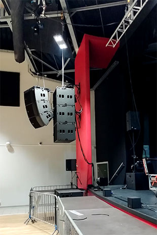 L-Acoustics A15 above three compact KS21subs