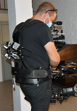 The camera mounted AMBEO VR Mic with four SK 6000 bodypack transmitters for wireless operation
