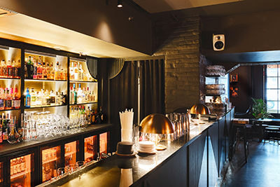 The bar at Lily Lee restaurant in Helsinki, Finland, featuring Genelec RAW loudspeakers 