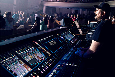 Production Manager Brenton Miles is running FOH sound, IEMs for the band, and ten VIP group mixes all from a single DiGiCo Quantum338 console