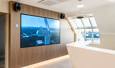 The lobby area at Ilmatar Windpower, featuring Genelec Smart IP loudspeakers 