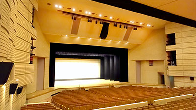 L-Acoustics Kara II in the proscenium’s centre, flanked by five Kara II per side for the proscenium’s LR hidden behind saran netted screens