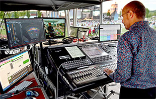 Sound designer and FOH engineer Jonathan Burke at the productions’ DiGiCo SD10 mixing console and L-ISA Controller display