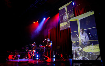 5GF trial testing of latency barriers with linked performances in the Brighton Dome and Metropolis Studios, 60 miles away in London