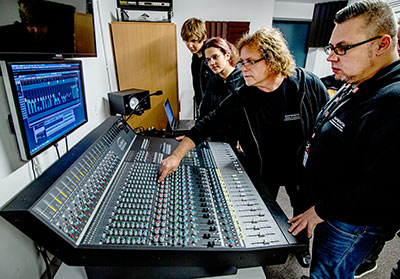 Áron Fazakas and József ‘Yogi’ Lénárd with students at the new console