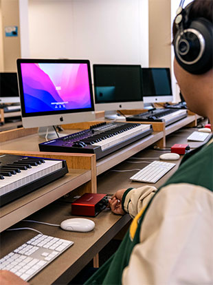 The music-production computer lab at University of Lethbridge features a Focusrite Scarlett Solo interface at each workstation