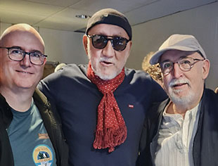 Iain Ogilvie (in baseball cap) with son John (left) with Pete Townshend 