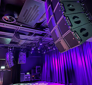  Four flown L-Acoustics SB18 subwoofers are flowing behind the main hangs due to the venue's height restrictions