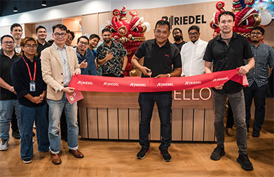 Mustapha Kamal cuts the ribbon at the office opening