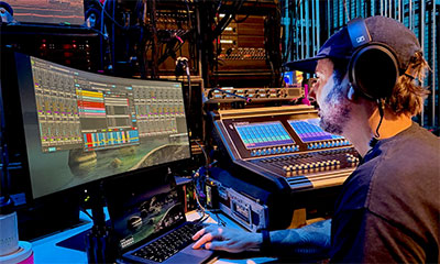Justin Milner monitors the broadcast via SoundBase