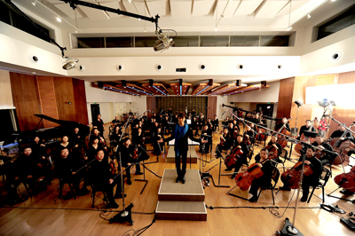 Village Studios owner Hins Cheung with 60 piece orchestra in the Live Room Village Studios owner Hins Cheung